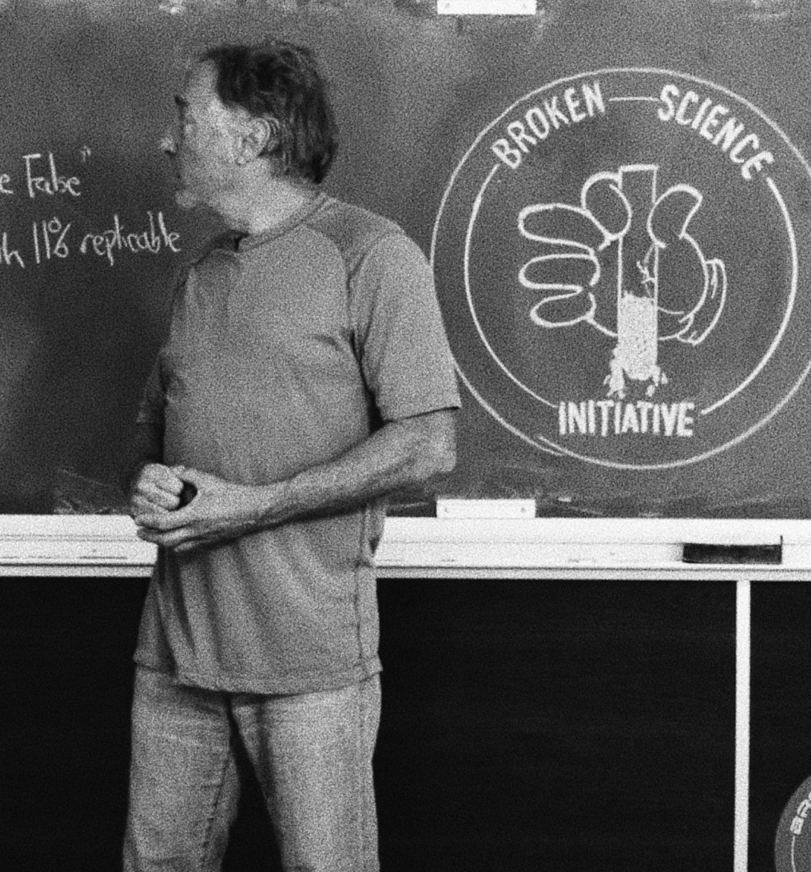 Greg Glassman in front of chalkboard with BSI logo