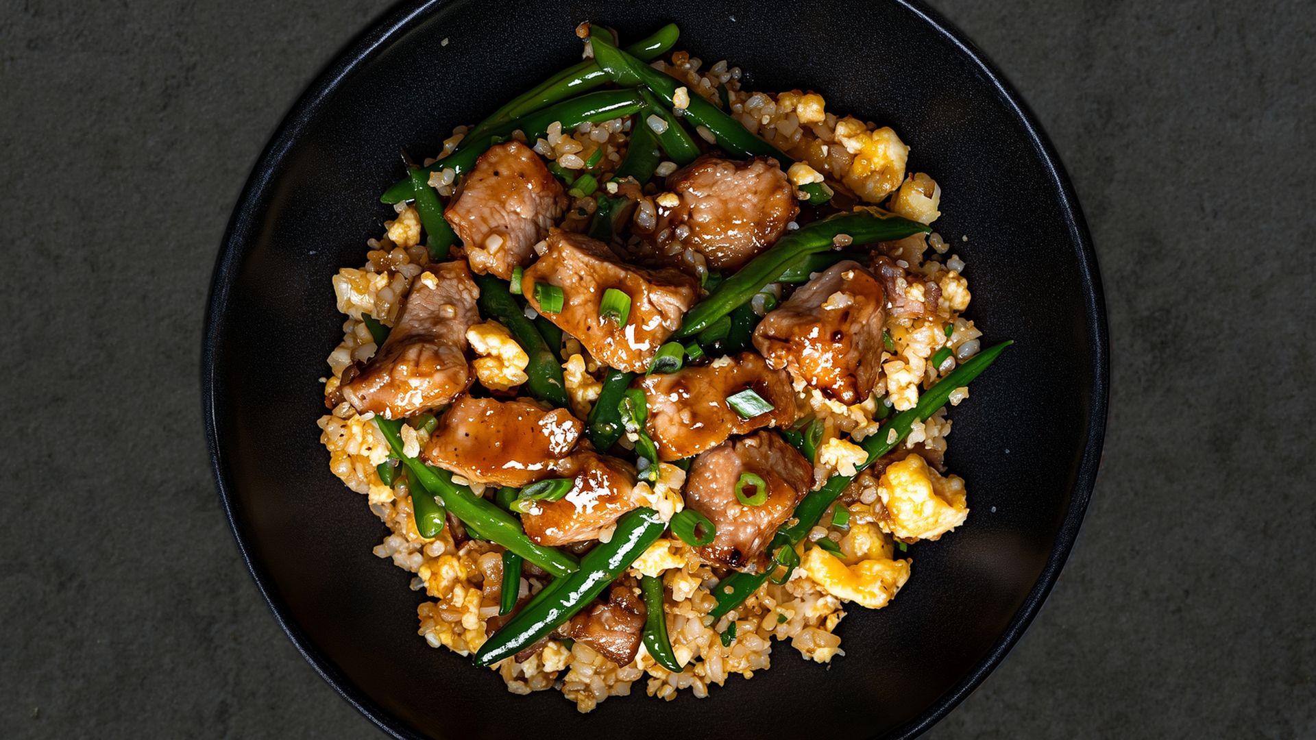 Photo of Pork & Green Beans over Cauliflower Fried Rice